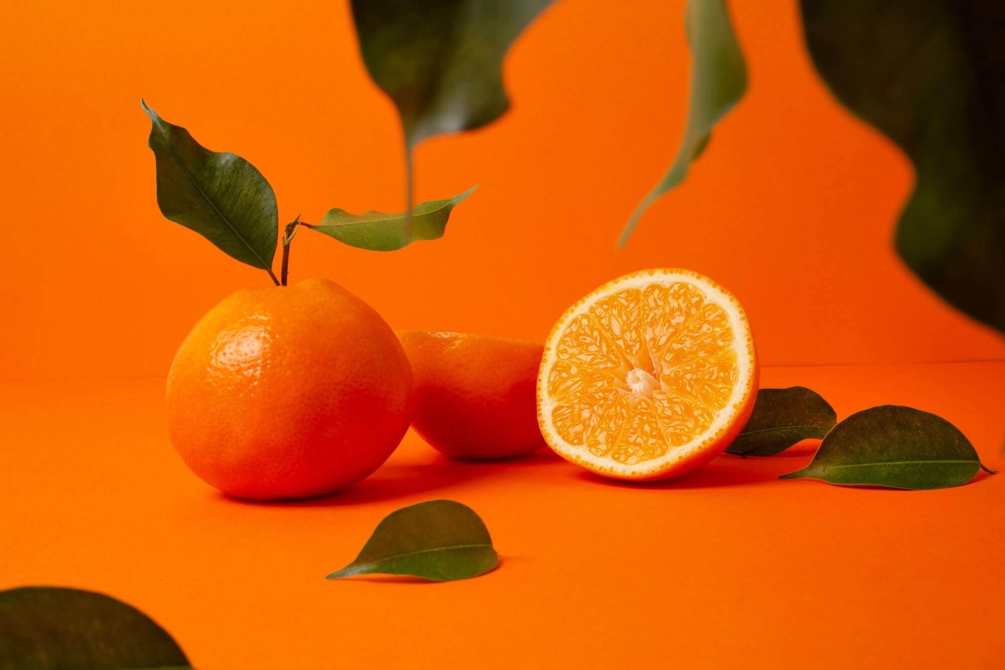 Closeup shot of appetizing oranges on the table, perfect for backgrounds Closeup shot of appetizing oranges on the table, perfect for backgrounds